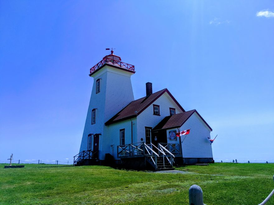 Glamour shot of Wood Islands lighthouse with its flag flying proud